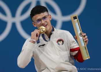 Lifter kebanggaan Indonesia, Rizki Juniansyah mempersembahkan medali emas kedua buat Tim Indonesia di Olimpiade Paris 2024. (Foto:NOC Indonesia/Naif Muhammad Al'as)