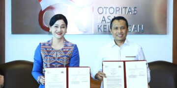Pejabat Sementara Wakil Ketua Dewan Komisioner Otoritas Jasa Keuangan Friderica Widyasari Dewi dan Kepala Badan Reserse Kriminal Kepolisian Negara Republik Indonesia Komisaris Jenderal Polisi Syahardiantono.(Foto: Dok. OJK)