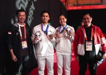 Pasangan ganda campuran bulu tangkis Indonesia, Amri Syahnawi/Nita Violina Marwah harus puas membawa pulang medali perak pada ajang Asian Games Aichi-Nagoya 2026. (foto:Gilang/kemenpora. go.id)