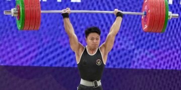 Lifter putra Indonesia, Rahmat Erwin Abdullah, mengungkapkan perasaannya usai berhasil meraih medali emas pada ajang Asian Games 2026 Aichi-Nagoya. (foto:Gilang/kemenpora.go.id)