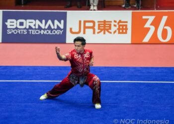 Atlet wushu putra Indonesia, Seraf Naro Siregar sukses menyumbangkan medali pertama bagi Indonesia pada ajang Asian Games 2026 di Aichi Perfectural Martial Arts Hall, Minggu (20/9).(foto:Gilang/kemenpora.go.id)